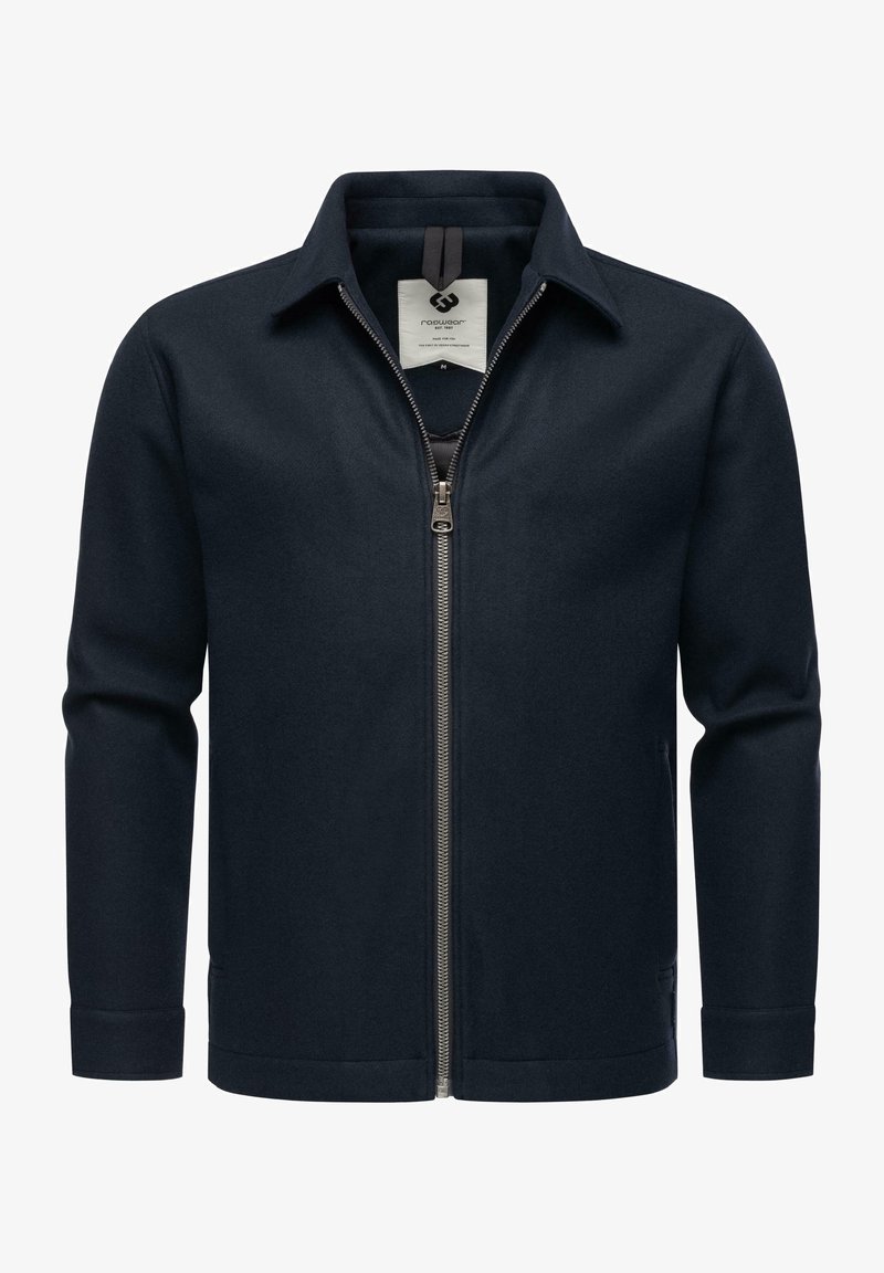 Mornarska jakna na zatvaranje s ovratnikom i dugim rukavima. Ima glatku teksturu tkanine i metalni zatvarač sprijeda.