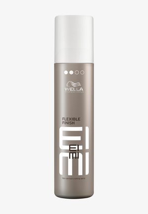 Spray modellante EIMI flexible finish di Wella Professionals, non aerosol, con tappo bianco e bottiglia cilindrica color taupe.
