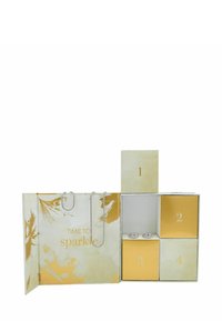Boîte-cadeau avec le texte "Il est temps de briller" ; motif floral crème et or ; quatre compartiments ; comprend des éléments en argent dans les compartiments 2 et 3.