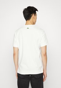 Lacoste T-shirt estampada - farine