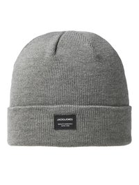 Gray knit beanie with a folded cuff, featuring a black label with brand name and text. Material appears soft and ribbed in texture.