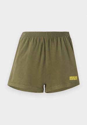 Olivrohelbed puuvillased lühikesed püksid elastse vöökohtaga ja sirge lõikega. Esiküljel on paremas alanurgas kollane "AMERICAN VINTAGE" logo.