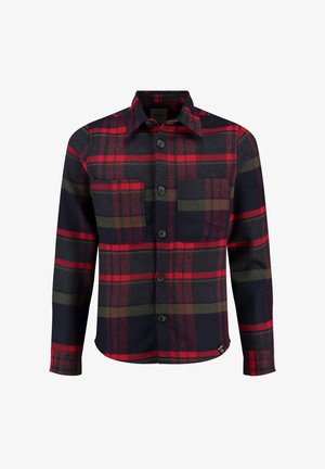 Camicia a quadri con colori rosso, verde e blu navy. Realizzata in un tessuto dalla consistenza morbida, ha una chiusura con bottoni e due tasche sul petto.