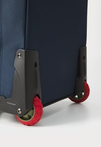 The North Face BASE CAMP VOYAGER 21 ROLLER UNISEX - Valise à roulettes - shady blue/summit navy