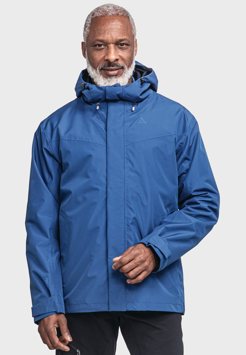 Blaue wasserdichte Jacke mit einer enganliegenden Kapuze, vorderem Reißverschluss und verstellbaren Manschetten. Sie hat eine glatte Textur und minimale Markenkennzeichnung.