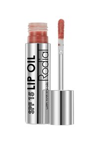 Rodial SPF 15 Lippenöl in einem transparenten Tube mit einem silbernen Deckel, weicher Applikator-Spitze und einem rosé-nude Öl im Inneren.