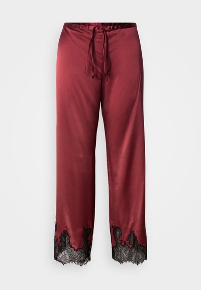 Burgundowe satynowe spodnie z ściągaczem w pasie i czarną koronkową lamówką przy brzegu. Gładka faktura i szeroki krój nogawek dla wygodnego noszenia.