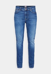 Jeans de mezclilla azul con una forma ajustada, que presentan un diseño de cinco bolsillos, cierre frontal con botón y un ligero desgate en las piernas.