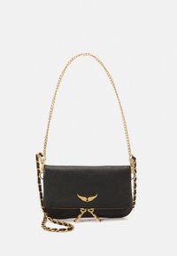 Black leather crossbody bag with gold chain strap, winged logo detail, and zip closure. Smooth texture and compact rectangular shape.