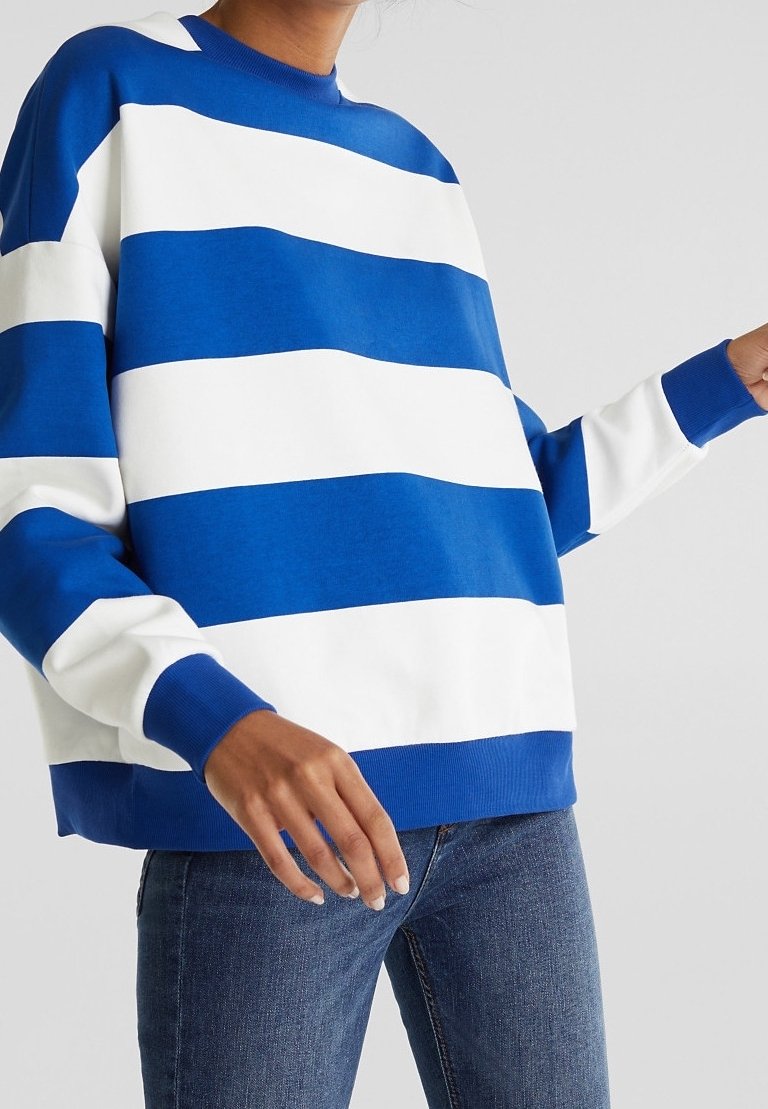Blue and white striped sweatshirt with long sleeves, a crew neckline, and ribbed cuffs and hem. Made of soft, textured cotton material.