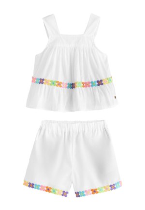 Weißes ärmelloses Top- und Shorts-Set mit buntem, besticktem Blumenbesatz entlang der Taille und der Beinöffnungen.