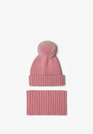 Pink knitted beanie with a fluffy pom-pom on top and a matching ribbed neck warmer, both featuring a textured, soft fabric.