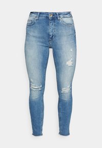 Blue denim skinny jeans with a faded wash, featuring distressed rips on the knees and a raw hem. Five-pocket design with gold hardware accents.