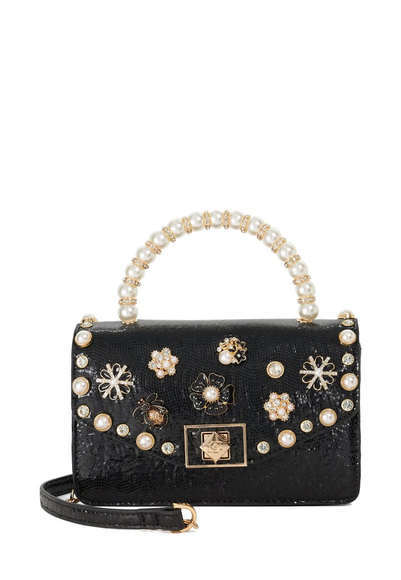 Black handbag with textured surface, pearl accents on the handle, and assorted floral embellishments in gold and silver, featuring a magnetic clasp.