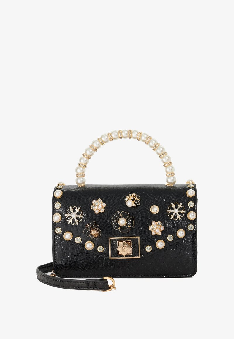 Black handbag with textured surface, pearl accents on the handle, and assorted floral embellishments in gold and silver, featuring a magnetic clasp.