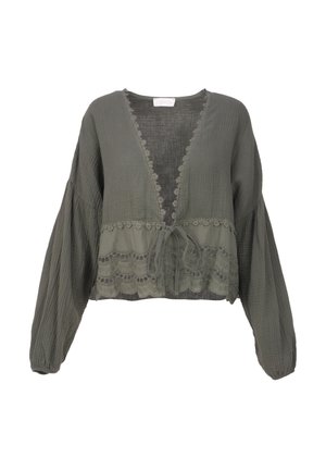Blouse cropped en vert olive en tissu léger, avec un décolleté en V, des manches longues et des détails en dentelle à la taille avec fermeture à lien.