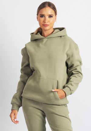 Olive green hoodie made of soft fabric, featuring a front pocket, adjustable hood, and relaxed fit. Paired with matching bottoms.