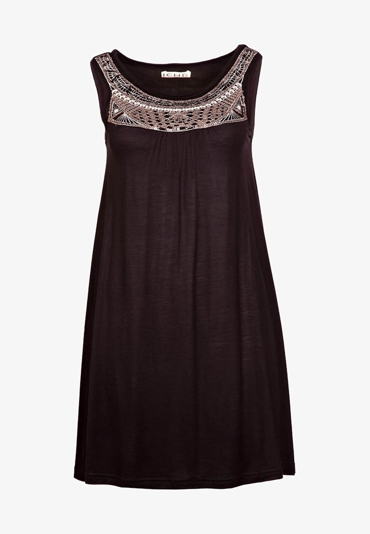 Abito nero senza maniche con scollo ricamato testurizzato. Tessuto morbido con una vestibilità rilassata, che cade justo sopra il ginocchio.