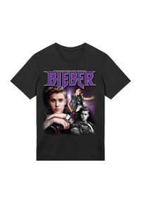 Black cotton t-shirt featuring a graphic print with multiple images and the word "BIEBER" in purple bold text.