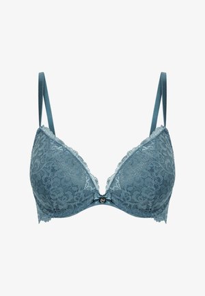 Reggiseno in pizzo blu con spalline regolabili, un piccolo fiocco e un ciondolo rotondo al centro frontale, progettato per supporto e stile.