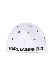 Bonnet en coton blanc avec des logos et des lettres noires dispersés partout. Présente un bandeau noir "KARL LAGERFELD" visible à la base.