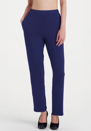 Pantaloni in tessuto elasticizzato leggero di colore blu navy, con finitura liscia, vita elastica e tasche laterali; fondo a punta.