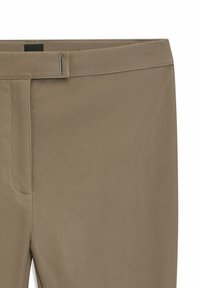 Beige faux leather pants with a smooth texture, featuring a flat waistband and discreet metallic hardware accent.