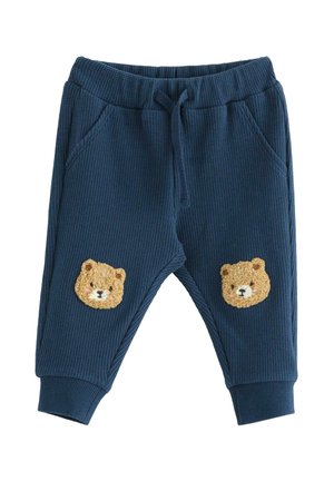 Marineblå teksturerede bukser til småbørn med elastisk talje, snor, sidelommer, ribkant ved anklerne og bamseansigtspatches på knæene.