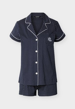 Navy blue short-sleeve pajama set with white polka dots, white piping trim, button-up top, and matching shorts, featuring "RL" logo on chest.