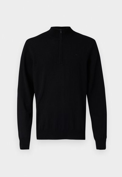 Μαύρο πουλόβερ με ψηλό λαιμό και κοντό φερμουάρ. Το ύφασμα φαίνεται λείο με ριμπ μανσέτες και τελείωμα. Μινιμαλιστικός σχεδιασμός.