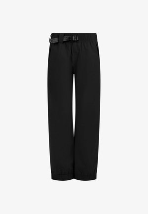 Schwarze, leichte und wasserabweisende Hose mit elastischem Bund und verstellbarem Gürtel. Mit elastischen Bündchen am Ende. Glatte Textur.