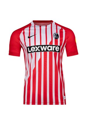 Koszulka piłkarska w pionowe czerwono-białe paski z czerwonymi rękawami, czarnym logo Nike, napisem sponsora Lexware i herbem klubu SC Freiburg na piersi.