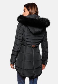 Black puffer jacket with a fur-trimmed hood, horizontal quilted design, adjustable waist, and zippered pockets. Plain back view.