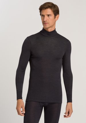 Sort langærmet turtleneck lavet af et blødt, fleksibelt stof. Slim fit med glat tekstur og minimale syninger.
