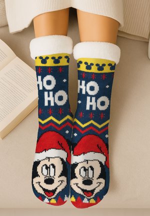Blue Christmas socks with red, yellow, and white patterns featuring a smiling Mickey Mouse in a Santa hat. Soft white fleece cuff.
