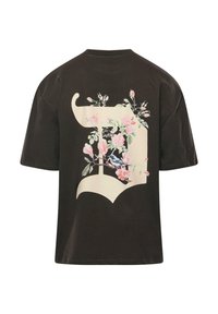 Black cotton t-shirt featuring a large floral graphic in pastel colors on the back, with a prominent design element resembling a stylized shape.