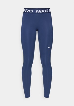 Αθλητικό κολάν σε ναυτικό μπλε χρώμα από λείο ύφασμα, με λευκή ταινία "Nike Pro" και μικρό λευκό σήμα Nike στο μπροστινό μέρος.