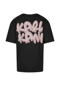 Black cotton t-shirt featuring large pink bubble text "KARL KANI" on the back. Short sleeves and relaxed fit. Smooth texture.