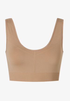 Nude sömlös bralette med breda axelband, ribbat band och panel-sömmar. Tillverkad av mjukt, stretchigt material för komfort.