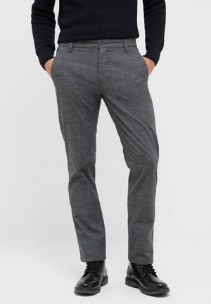 Gray patterned trousers made of woven fabric, featuring a slim fit, side pockets, and a button closure, paired with black boots.