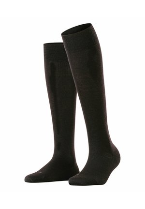 Tot de knie hoge zwarte sokken van een zachte, gewoven stof, met een versterkte neus en een gladde afwerking, geschikt voor formele of casual kleding.