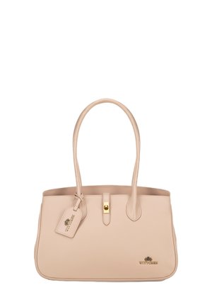 Sac fourre-tout en cuir beige avec deux longues poignées, forme structurée, quincaillerie dorée et une étiquette attachée portant le nom de la marque "WITTCHEN."