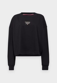 Felpa nera corta in tessuto misto cotone, con collo a giro e maniche lunghe, con il logo "tommy jeans" in bianco sul davanti.