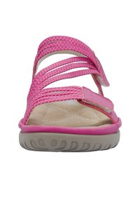 Pink sandal with woven straps, adjustable Velcro closure, and a cushioned beige insole. Features a flexible rubber outsole with textured grip.