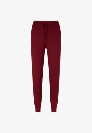 Pantaloni jogger color rosso vino con vita elasticizzata, cordoncino, tasche laterali e polsini aderenti, esposti su sfondo bianco.