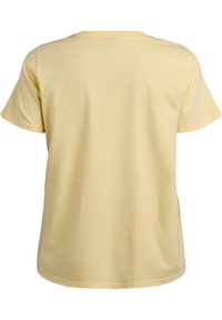Gul bomull T-shirt med korta ärmar och rundad halsringning. Baksidan har en slät yta utan mönster eller dekorationer.