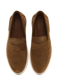 Brown suede slip-on shoes with a smooth finish, rounded toe, and white rubber sole. Features a stitched seam along the upper.