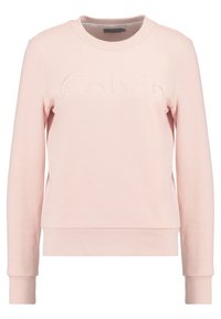Sudadera de color rosa claro hecha de tela suave, con cuello redondo, mangas largas y el logo en relieve "Calvin" en la parte frontal. Puños y dobladillo de canalé.