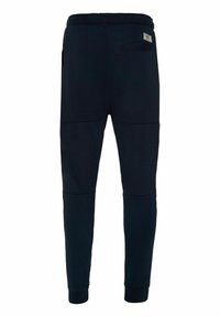 Marineblaue Jogginghosen aus weichem Stoff mit einem elastischen Bund, schmal zulaufenden Beinen und seitlichen Reißverschlusstaschen für Funktionalität.