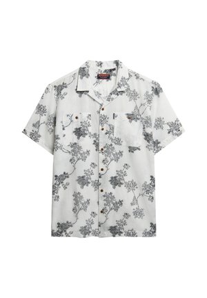 Kortærmet skjorte med knapper, hvid med sort blomsterprint, to brystlommer, træknapper, afslappet pasform, letvævet stof.